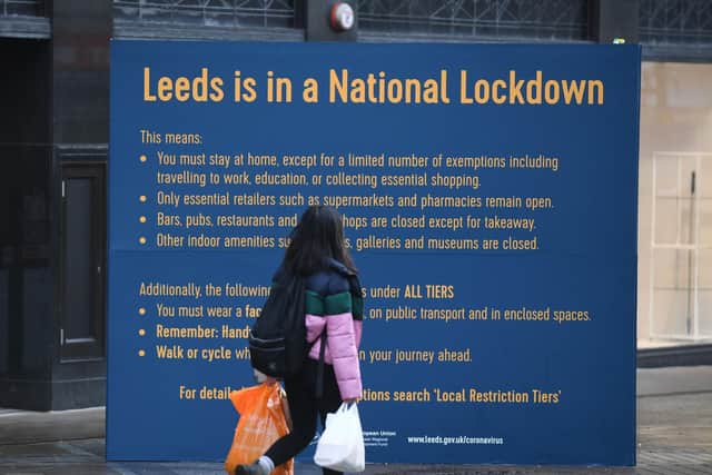 Signage in Leeds city centre spells out the lockdown restrictions. Picture: Simon Hulme