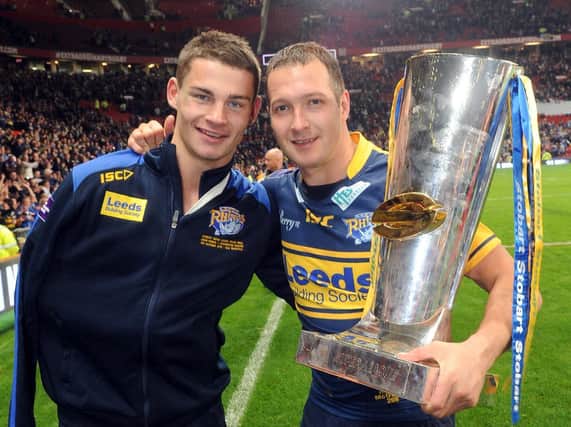Stevie Ward, left, with teammate Danny McGuire and the Super League trophy at Old Trafford in 2012. Picture by Steve Riding.