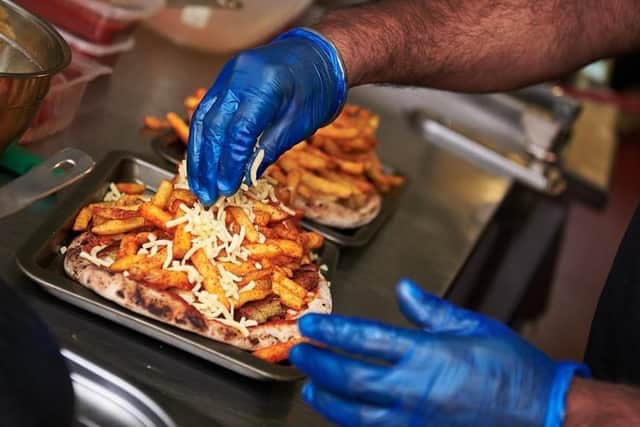 The 'naan pizzas' are topped with tomato sauce, meat or vegetarian toppings and loaded with masala fries