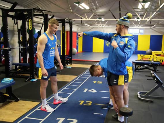 Harry Newman, left, working in Rhinos' gym this week, alongside assistant-coach Chev Walker and Callum McLelland, who is also recovering from surgery. Picture by Phil Daly.