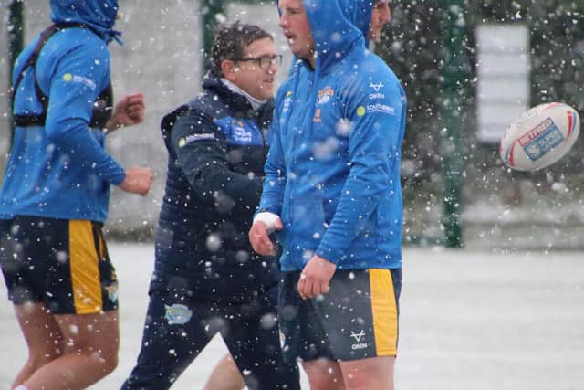 Tom Holroyd looked to be feeling the cold at training in the snow on Friday. Picture by Phil Daly.