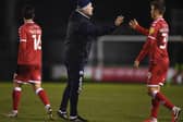 KEY MEN: Crawley Town boss John Yems, centre, with midfielder Jake Hessenthaler, right, and striker Tom Nichols, left, after the 2-1 victory at Forest Green Rovers in which Nichols hit a brace. Photo by Harry Trump/Getty Images.