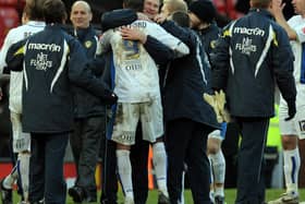 WE DID IT! Boss Simon Grayson hugs match-winner Jermaine Beckford after the 1-0 win against Manchester United at Old Trafford in the FA Cup third round of January 2010. Photo credit should read PAUL ELLIS/AFP via Getty Images.