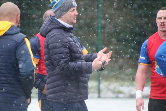 Coach Richard Agar supervises Rhinos' training in the snow at Kirkstall on Friday. Picture by Phil Daly.