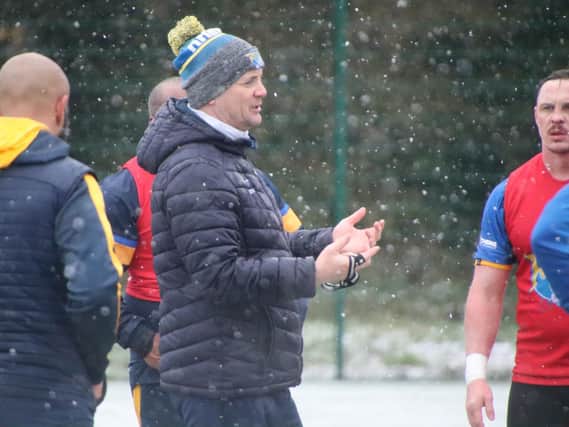 Coach Richard Agar supervises Rhinos' training in the snow at Kirkstall on Friday. Picture by Phil Daly.