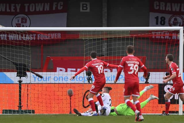 OUT: Jordan Tunnicliffe blasts home Crawley Town's third goal as Leeds United crash out of the FA Cup third round. Photo by Mike Hewitt/Getty Images.