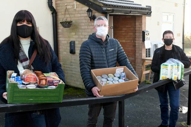 Local Leeds City Councillors (left to right) Mirelle Midgley, James Lewis and Mary Harland with food parcels at the Kippax Band Club which houses Kippaxs' first foodbank.
Photo: Gary Longbottom