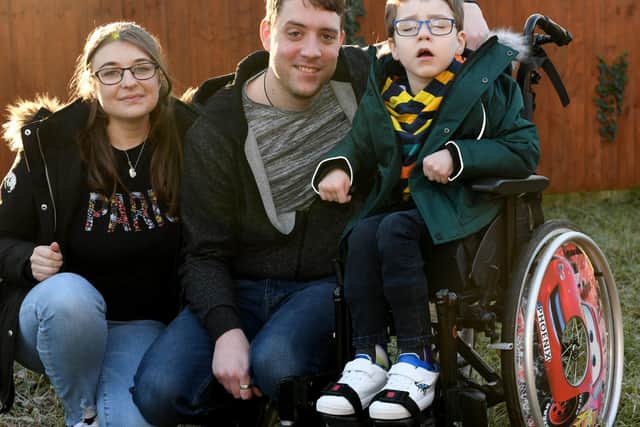 Five-year-old Phoenix Milner pictured with dad Ben, 31, and mum Lora Bedford, 30