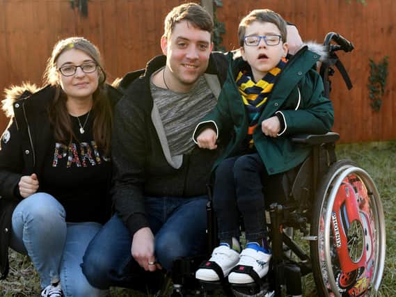 Five-year-old Phoenix Milner pictured with dad Ben, 31, and mum Lora Bedford, 30