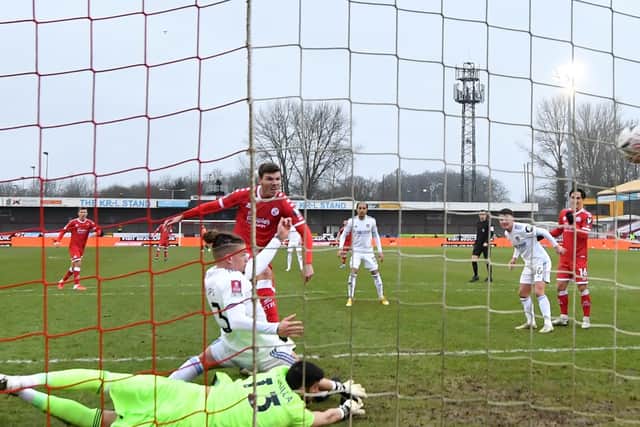 HEADING OUT: Leeds United duo Kalvin Phillips and Kiko Casilla are unable to keep out Jordan Tunnicliffe's strike that put Crawley Town 3-0 up in Sunday's third round FA Cup tie. Photo by GLYN KIRK/AFP via Getty Images