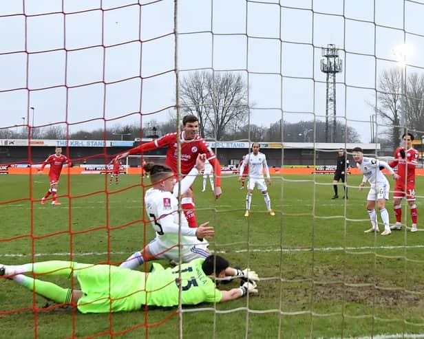 HEADING OUT: Leeds United duo Kalvin Phillips and Kiko Casilla are unable to keep out Jordan Tunnicliffe's strike that put Crawley Town 3-0 up in Sunday's third round FA Cup tie. Photo by GLYN KIRK/AFP via Getty Images