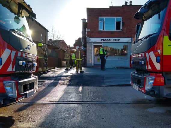 The fire broke out in a flat above Pizza Top in Whitehall Road, Wortley, Leeds