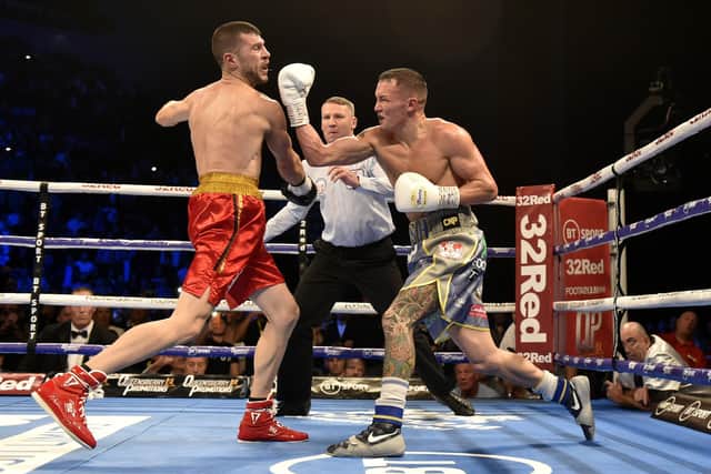 Josh Warrington gets in a last big punch on Sofiane Takoucht at Leeds Arena back in October 2019 before the referee moves in to stop the fight. Picture: Steve Riding.