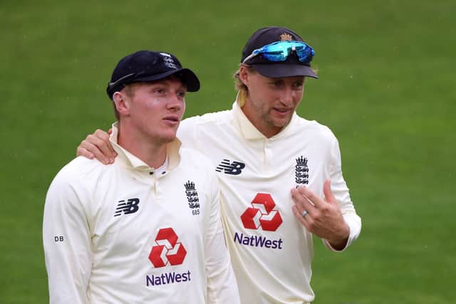 SPINNERS' UNION: England's Joe Root (right) and Dom Bess walk off the pitch as rain stops play during day one of the Second Test match at the Ageas Bowl last August. Picture: Stu Forster/NMC Pool/PA
