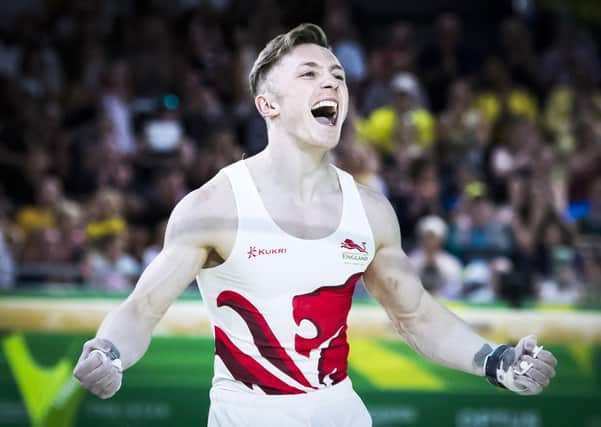 England's Nile Wilson (gold) celebrates following his routine on the Men's Horizontal Bar at the 2018 Commonwealth Games. Picture: Danny Lawson/PA
