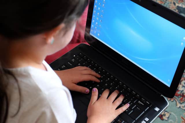 Children need laptops to study from home during the lockdown (photo: PA).
