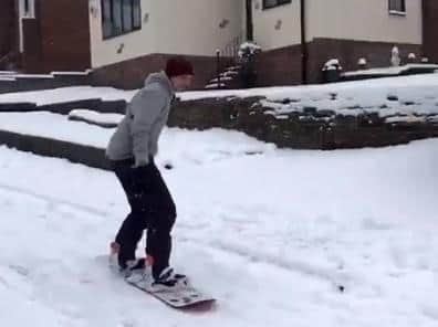 Nial Irwin snowboarding down Wadlands Rise in Farsley.