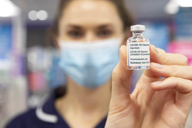 Mary Saunders, Regional Nurse Manager holds the AstraZeneca/Oxford Covid-19 vaccine at Superdrug in Guildford. Photo: PA