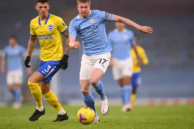 'OUR PLAYER NOW': Brighton's former Leeds United loanee Ben White, left, tracks Manchester City's Kevin De Bruyne in Wednesday night's Premier League clash. Photo by LAURENCE GRIFFITHS/POOL/AFP via Getty Images.