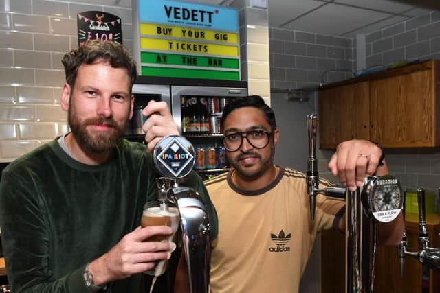 Simon Rix and Vijay Mistry, of the Kaiser Chiefs, pull a pint at the Brudenell Social Club. Photo: Jonathan Gawthorpe. 28th July 2019.