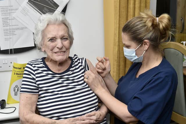 Alexandra Court Care Home resident Freda Hyde, 93, receiving her first Covid-19 vaccination at Alexandra Court care home in West Park, Leeds.

 Photo: Steve Riding