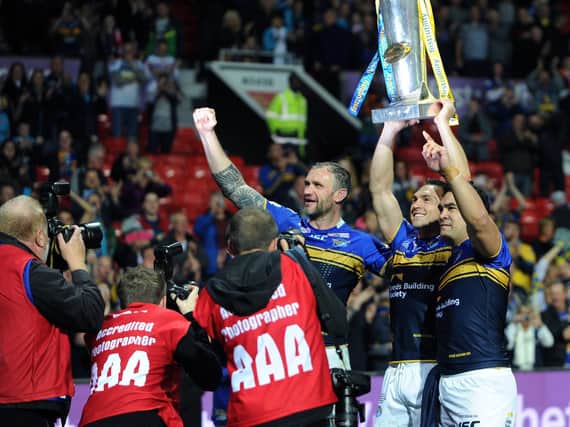 Jamie Peacock, left, celebrates Rhinos' 2015 Grand Final win, along with Kevin Sinfield and Kylie Leuluai. Picture by Jonathan Gawthorpe.