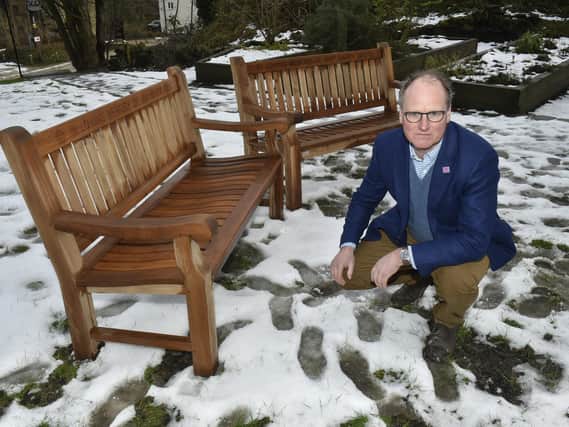 William Gaunt, joint managing director of Sunny Bank Mills, with the memorial benches. Picture: Steve Riding