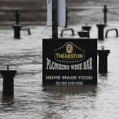 Flood water rises up a sign outside a pub in York as Storm Christoph is set to bring widespread flooding, gales and snow to parts of the UK. Photo: PA
