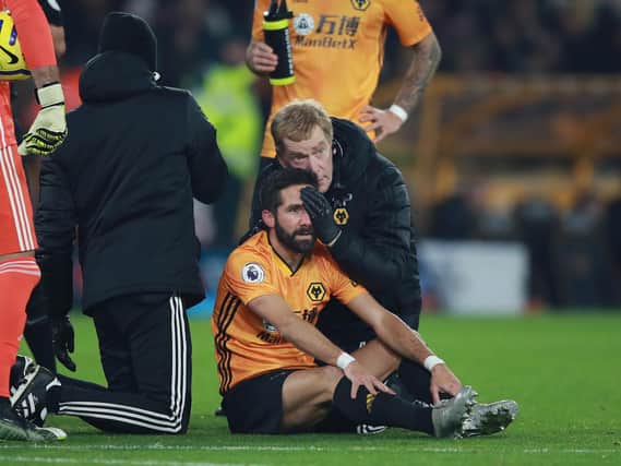 NEW PROTOCOL - Joao Moutinho of Wolverhampton Wanderers receives medical treatment during the Premier League match between Wolves and West Ham United at Molineux. Pic: Getty