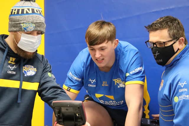 Jack Broadbent undergoes fitness testing in Rhinos' gym, supervised by sports scientist Dan Weaving, left and head of physical performance Jason Davidson. Picture by Phil Daly/Leeds Rhinos.