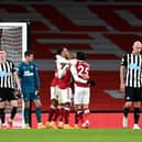 RALLYING CRY: From Newcastle United captain Jamaal Lascelles, right, pictured heading back to the centre circle after Pierre-Emerick Aubameyang's second goal in Arsenal's 3-0 victory at The Emirates. Photo by Shaun Botterill/Getty Images.