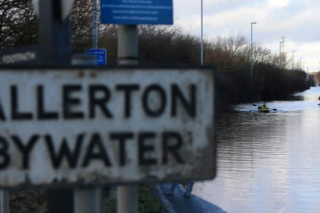 A canoeist paddles along a flooded West Yorkshire street as Storm Christoph brings heavy rains and flooding across England. (Photo by Lindsey Parnaby / AFP) (Photo by LINDSEY PARNABY/AFP via Getty Images)