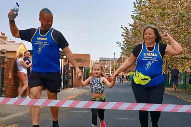 Ada Butterfield with mum Emma and dad Mick in April 2020  finishing a 2.6 mile running challenge in Allerton Bywater, which raised £4,000 for the Children’s Liver Disease Foundation.