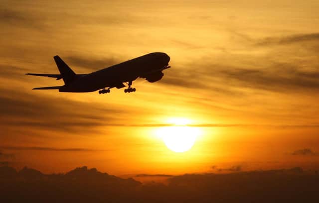 File photo dated 19/11/08 of a plane taking off at sunset. Airlines are being investigated by the competition watchdog over concerns they breached consumer rights by failing to offer cash refunds for flights passengers could not take amid the pandemic.