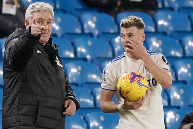 FIVE STAR WHITES: Newcastle United boss Steve Bruce, left, with Leeds United's Gjanni Alioski during December's 5-2 defeat at Elland Road. Photo by TIM KEETON/POOL/AFP via Getty Images.