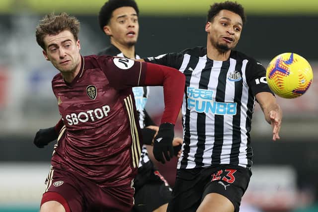 TOUGHING IT OUT: Leeds United striker Patrick Bamford, left, in Tuesday evening's 2-1 victory against Newcastle United at St James' Park. Photo by Lee Smith - Pool/Getty Images.