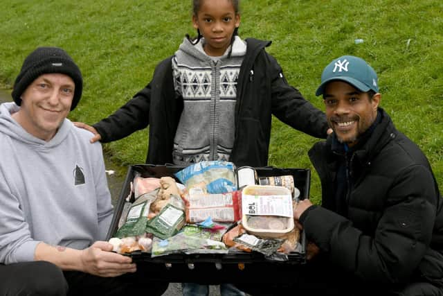 Lloyd 'Sketch' Herah (right) from Meanwood, Leeds, with son Aston Leslie, seven,  and neighbour Peter Makin with a food box they have put together for members of the  Delta-Alpha-Delta  group.

Photo: Gary Longbottom