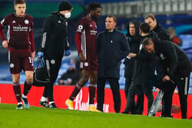 OUT: Leicester City midfielder Wilfred Ndidi, centre, pictured coming off with a slight hamstring tear in Wednesday evening's 1-1 draw at Everton as boss Brendan Rodgers looks on. Photo by Jason Cairnduff via Getty Images.