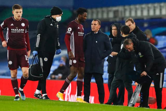 OUT: Leicester City midfielder Wilfred Ndidi, centre, pictured coming off with a slight hamstring tear in Wednesday evening's 1-1 draw at Everton as boss Brendan Rodgers looks on. Photo by Jason Cairnduff via Getty Images.