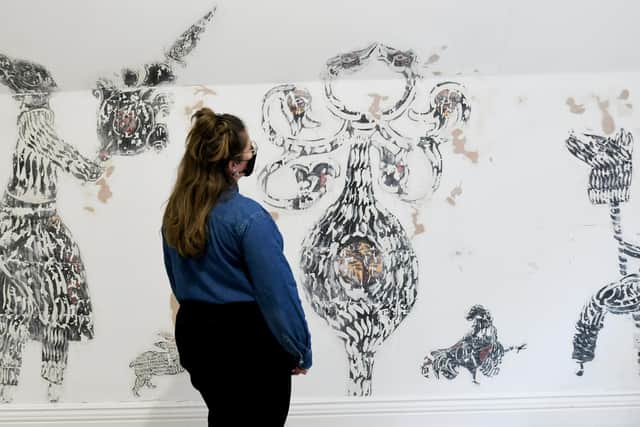 Arts Hostel assistant manager Hannah Platt in of the rooms that is in progress of being decorated by Iranian Artist 'Mo' Mohammad Barrangi.

Photo: Gary Longbottom