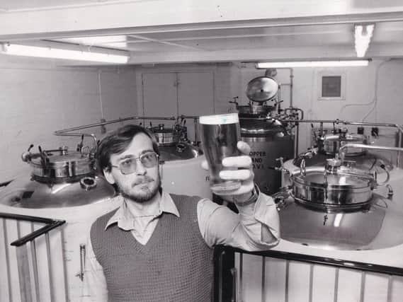 Tony Marks, manager of the Fox & Newt in Burley tests a pint brewed on the premises.
