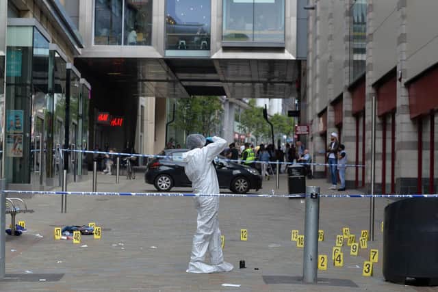 Forensic evidence is gathered at the scene of a stabbing in Leeds city centre in May 2018. Picture: Bruce Rollinson