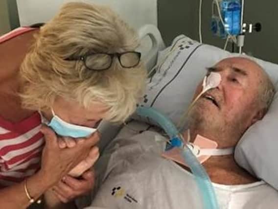 Bill Annable pictured in hospital in Tenerife with his wife Dot