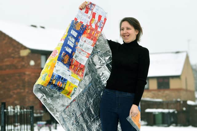 Emma Robison with one of her blankets made from crisp packets (photo: Jonathan Gawthorpe).