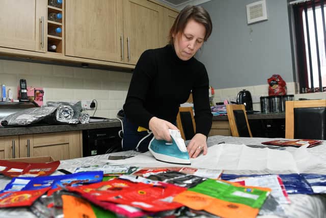 Emma irons the packets together to make the blankets (photo: Jonathan Gawthorpe).