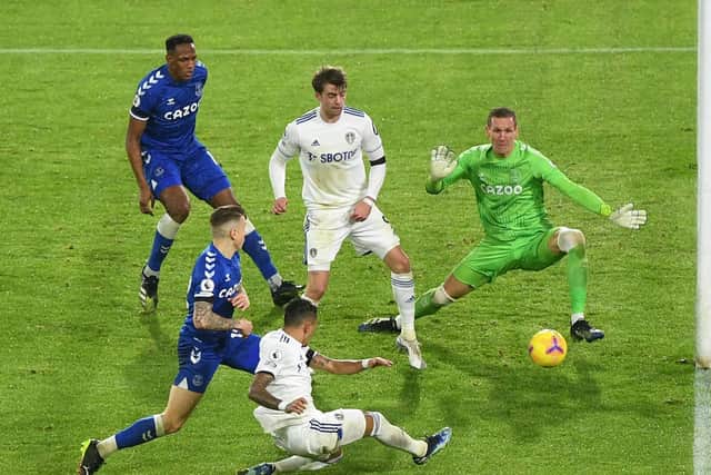 HEROICS: Everton's Swedish goalkeeper Robin Olsen somehow keeps out Leeds United winger Raphinha's strike from a tight angle, seconds after also denying Mateusz Klich. Photo by MICHAEL REGAN/POOL/AFP via Getty Images.