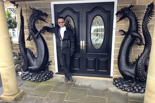 Gerry Layton with his dragons outside his Wigton Lane home.