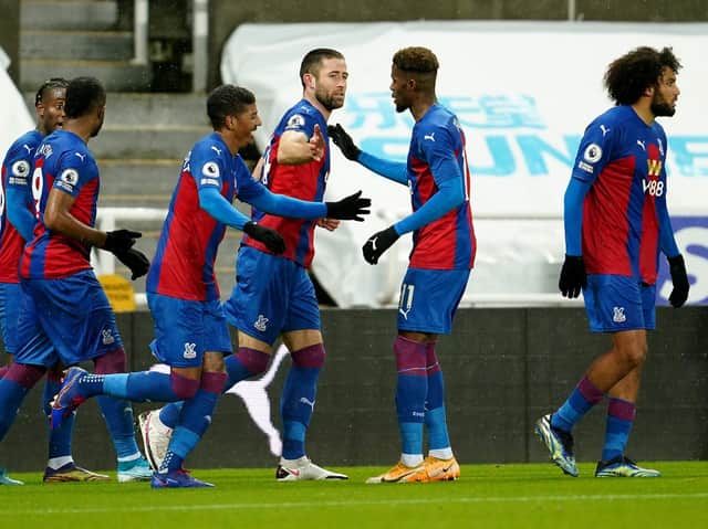 MAJOR BLOW - Crystal Palace star Wilfried Zaha, pictured celebrating Gary Cahill's goal against Newcastle United, will certainly miss the visit to Leeds United on Monday. Pic: Getty