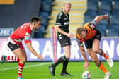 Tigers' long-serving number four Michael Shenton evades new teammate Niall Evalds to score during last year's win over Salford. Picture by  Allan McKenzie/SWpix.com