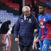 SPATE OF INJURIES: For Crystal Palace boss Roy Hodgson, left, pictured with Wilfried Zaha, right, who will miss Monday's clash at Leeds United with a hamstring injury. Photo by John Walton - Pool/Getty Images.